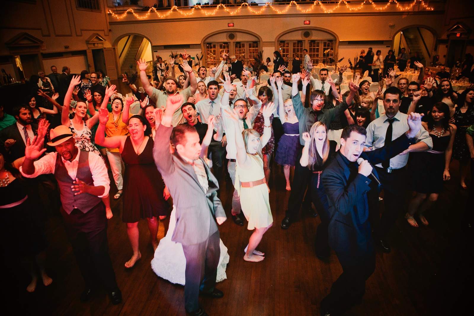 A packed reception dance floor