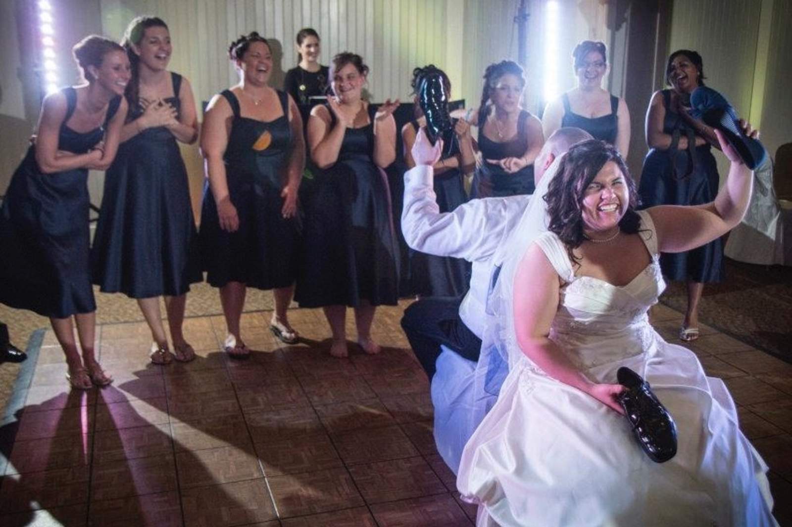 A bride dancing with her bridesmaids
