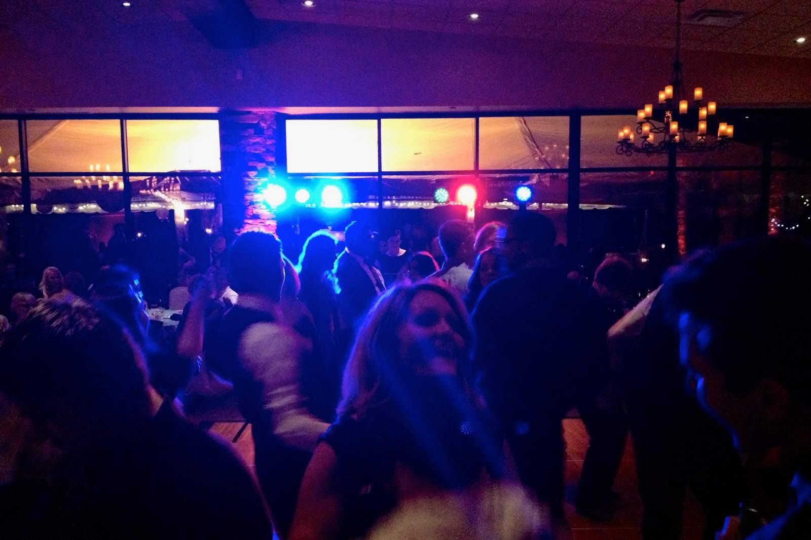 A dance floor glowing in blue light